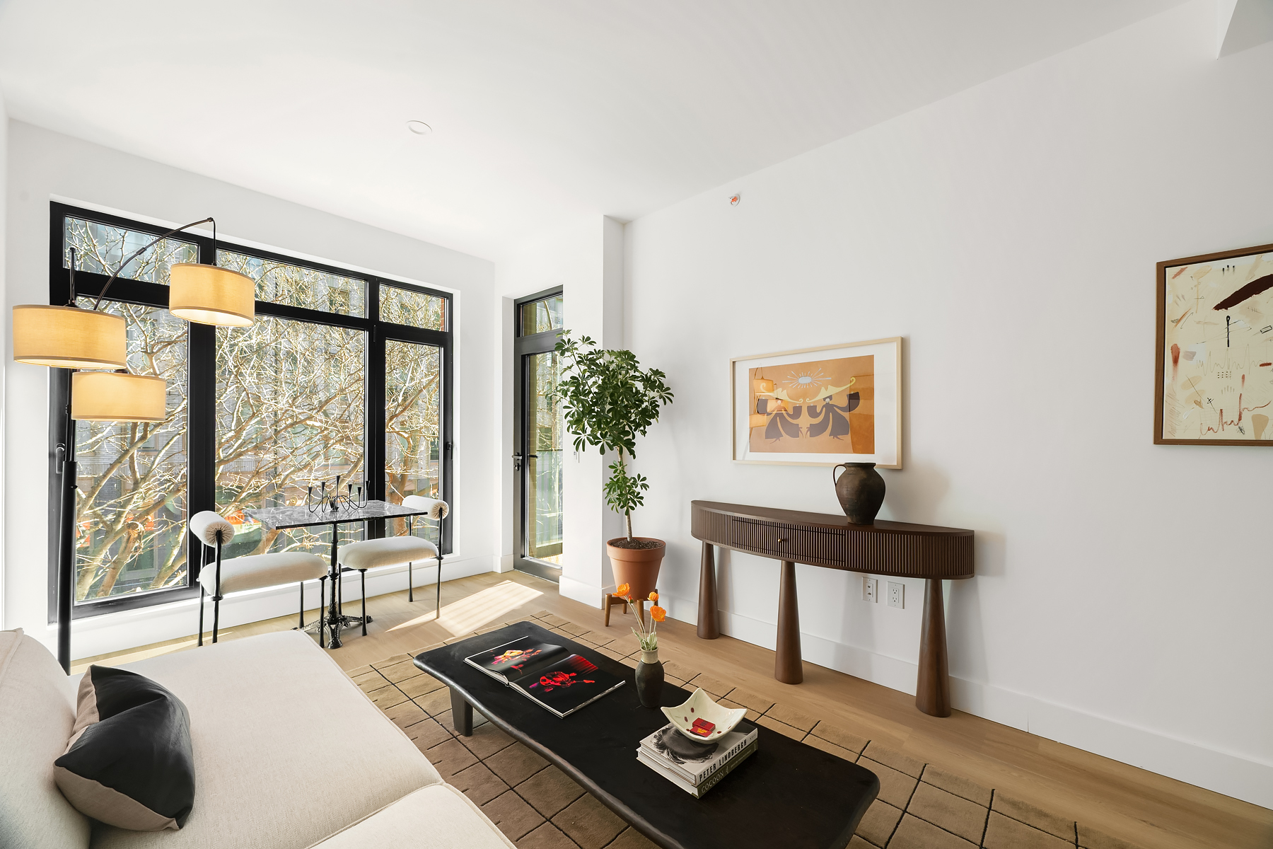 Living room angle with floor-to-ceiling windows